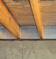 SilverGlo™ insulation installed in a floor joist in Lake Ariel
