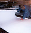 Yonkers insulation being installed in a crawl space.