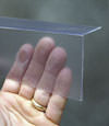 Closeup of a clear plastic covering on a Schenectady crawl space block wall