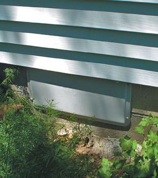 A gray crawl space vent cover in Chappaqua