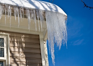 Ice damming on a NY & PA home's roof and gutters
