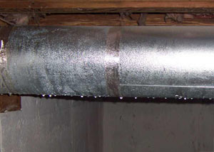 condensation collecting on an HVAC vent in a humid Lake Ariel basement
